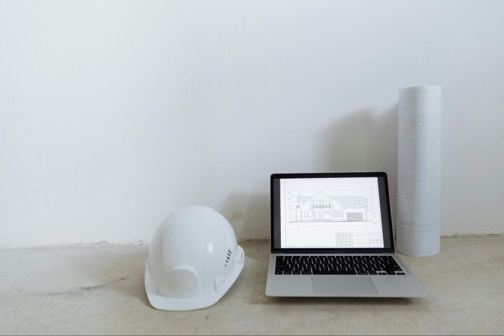 Offshore cad drafter working floor plans laptop